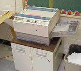 A small, much-used Xerox copier in a high school library.